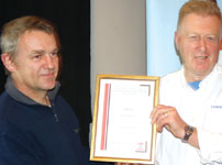 Jay King presents Bob Petrie with the SAIMC presenters certificate.
